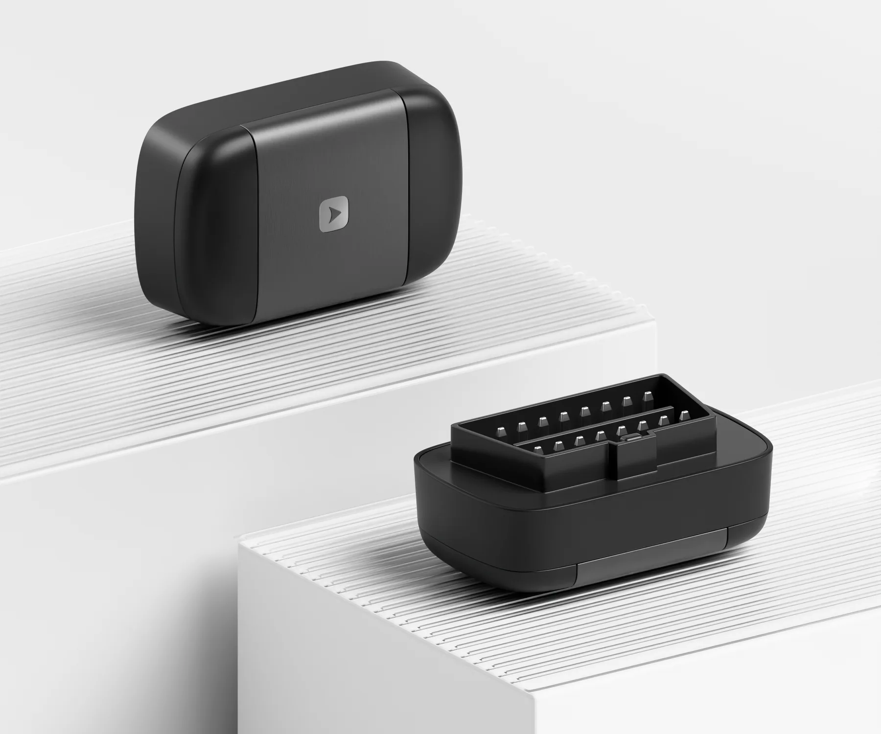 Two DashMate AI readers showing the front and the connector