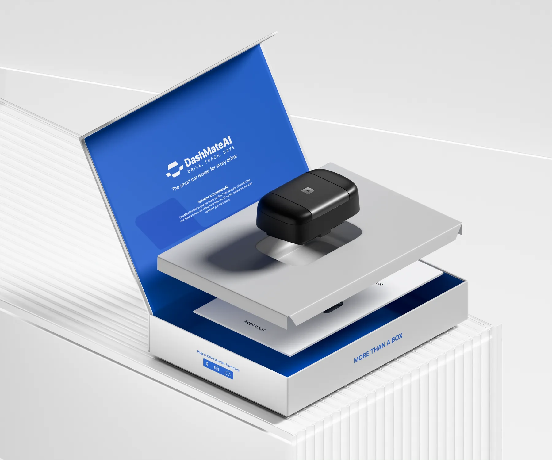 Open DashMate AI box with the tray lifted above the manual