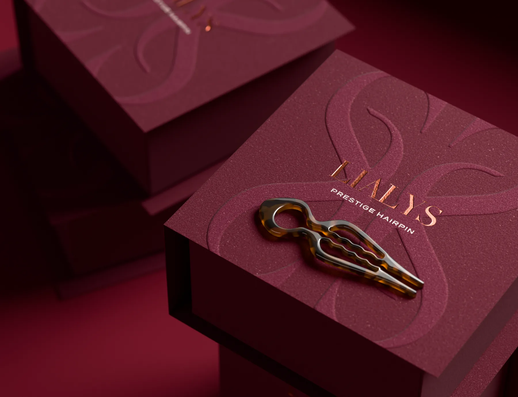Burgundy LiaLys rigid box with the hairpin on the lid