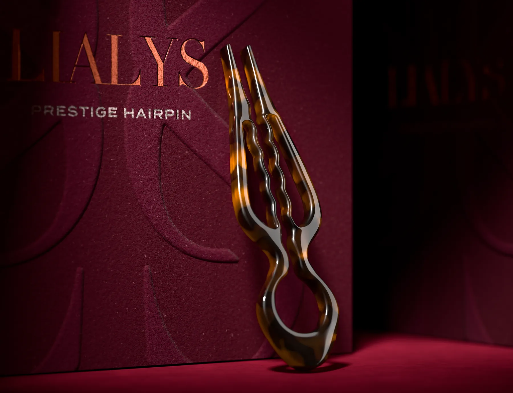 LiaLys tortoiseshell hairpin standing against the burgundy box