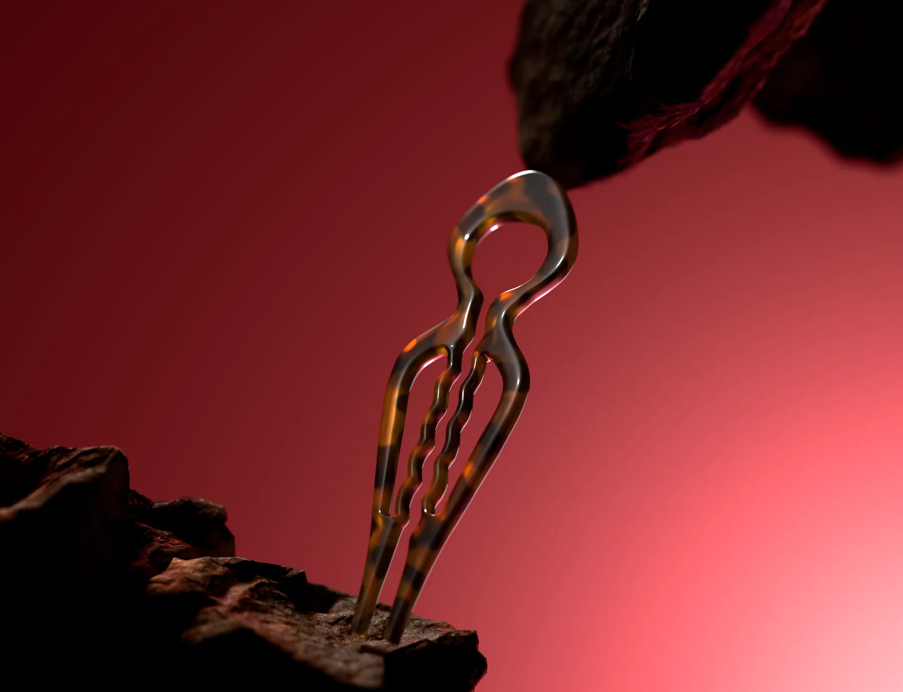LiaLys hairpin on a dark rock against a red backdrop
