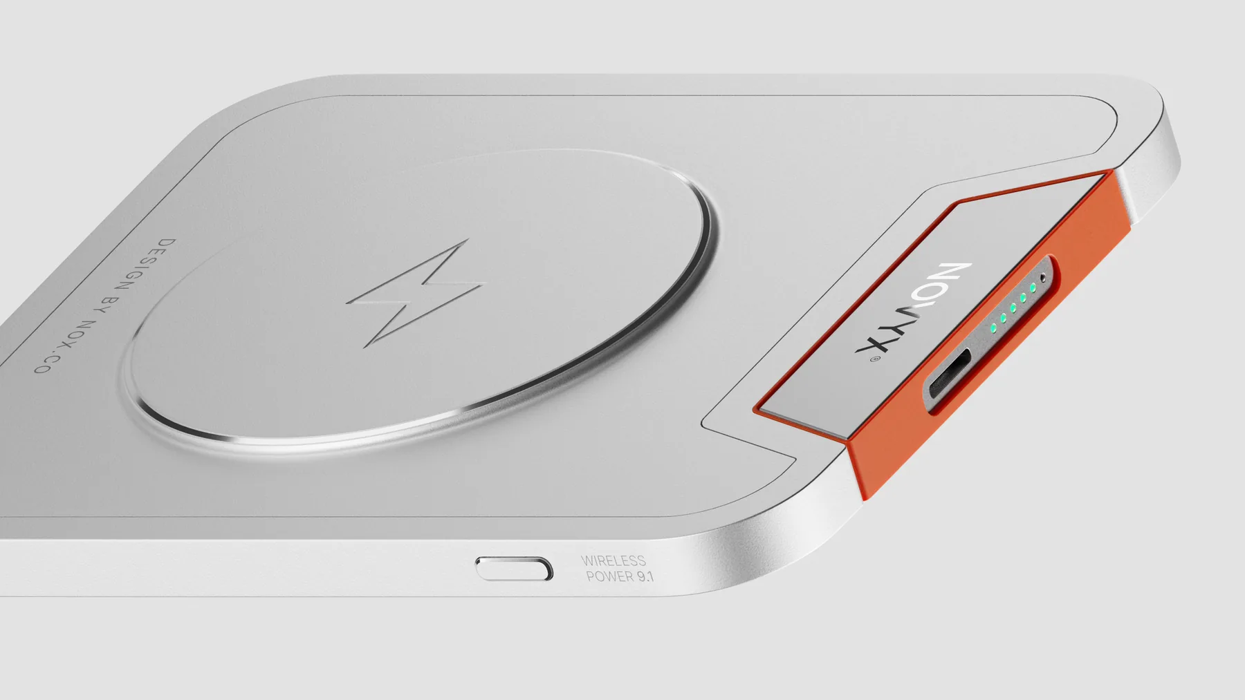 Novyx wireless power bank in brushed aluminum with an orange edge