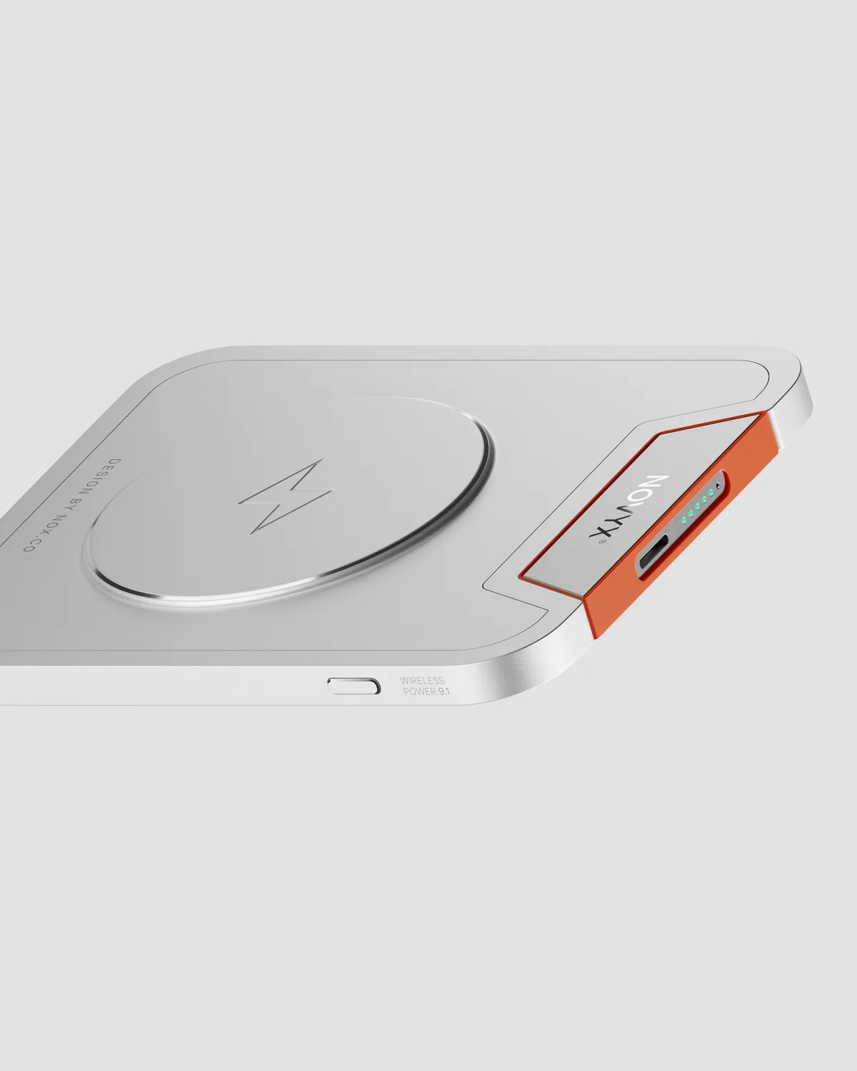 Novyx wireless power bank in brushed aluminum with an orange edge